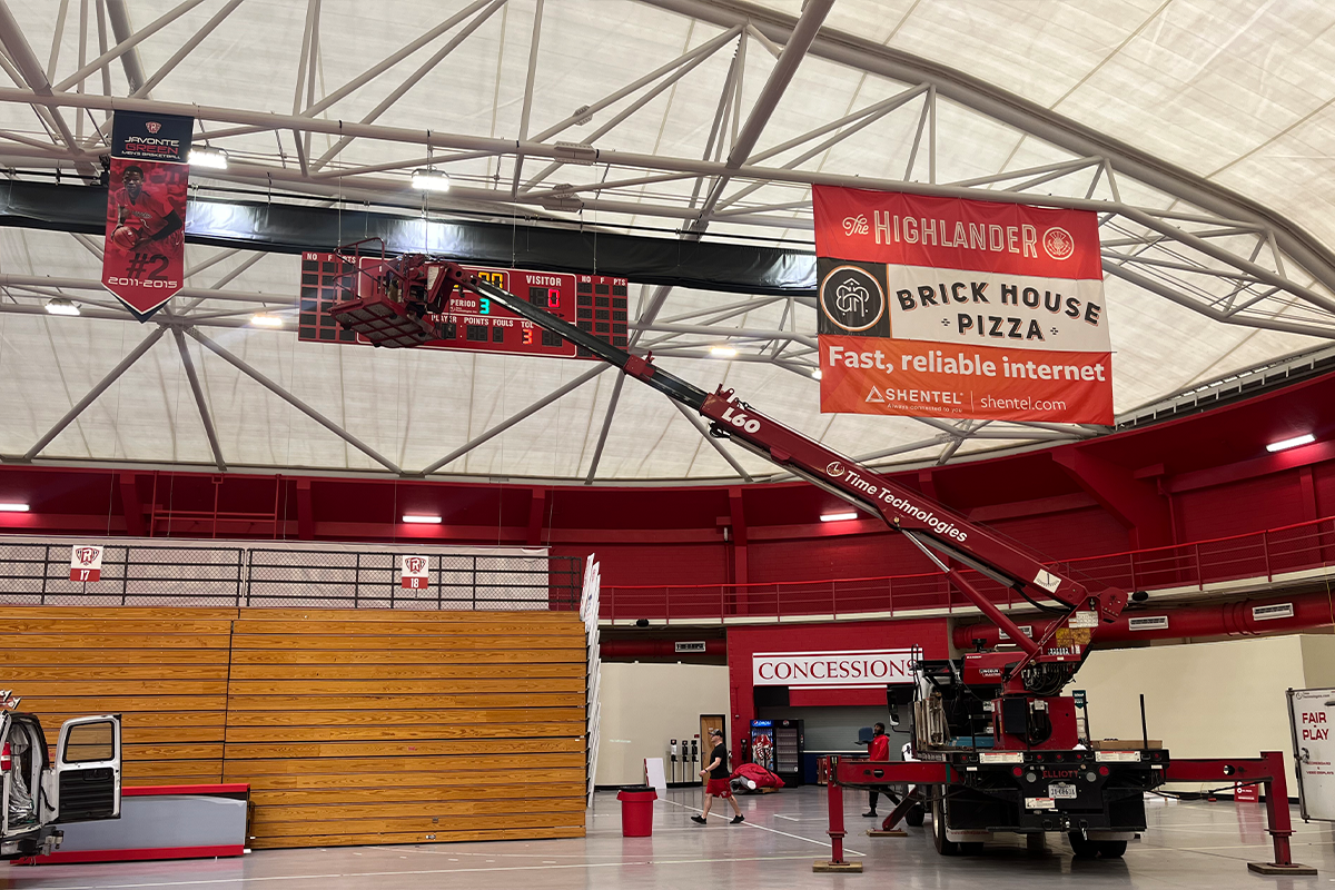 Radford Project Scoreboard Installation by Time Technologies Showing Big Bucket Truck Inside Basketball Gym