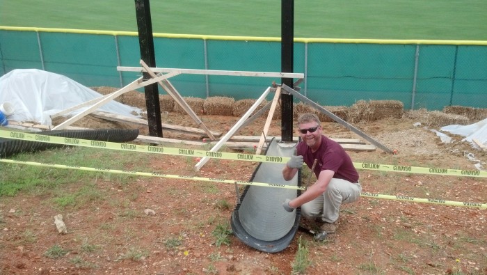 Installation of Steel I beams on a steep slope at Wedding High School's Baseball Field