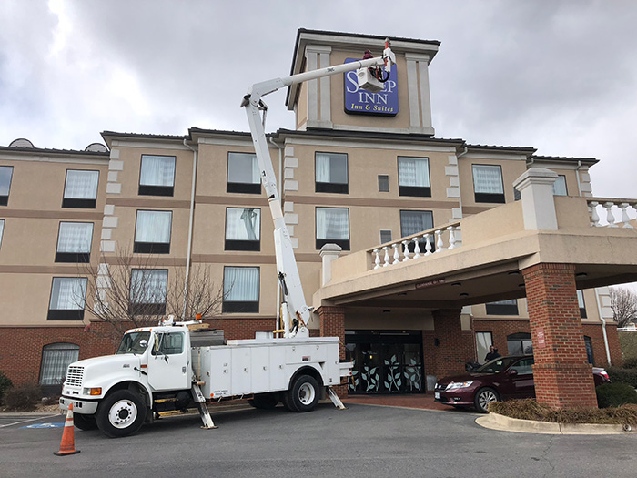60' Bucket Truck - Installing new LEDs in an existing motel sign in Lexington, VA.